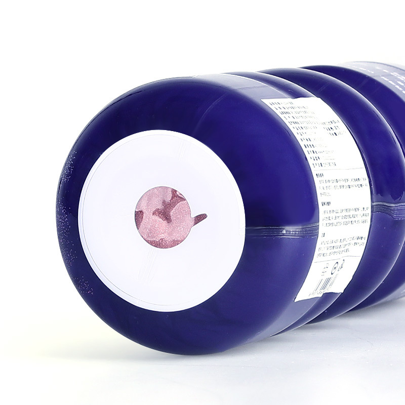 Supplier underside and side-label view of the blue MOON container. The coloured bottom sticker and printed side label are source packaging references, not inferred accessory contents.